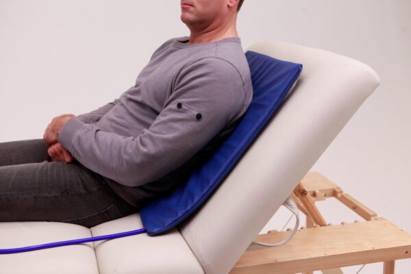 Man laying back and resting on Parmeds Therapy pad