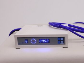 parades Multi Flash (Curatron) PEMF Device on table with single loop applicator plugged in