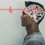 Man stands with a side profile and waves re going through his brain (a drawing) after a stroke