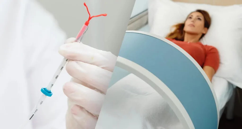 Woman having an IUD Implanted while laying in hospital bed