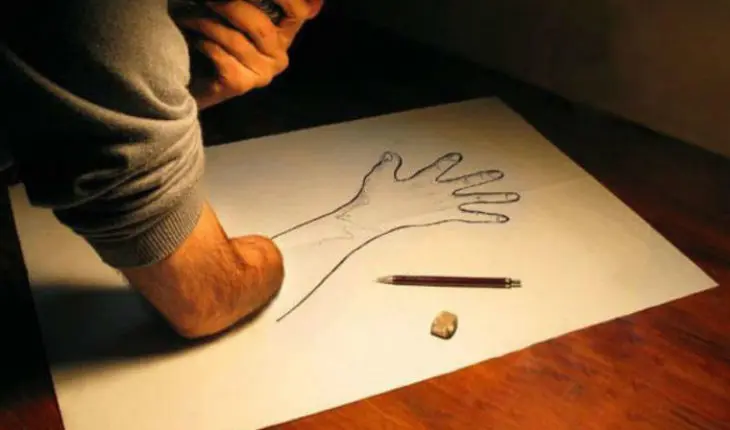 Man holding his amputated arm down to a drawing of an arm to show how phantom pains work